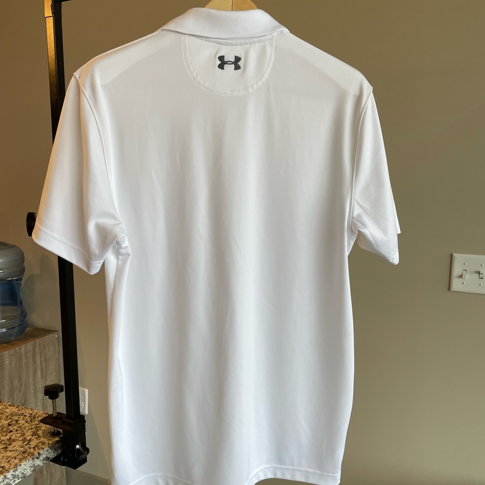 Light cream color under armor polo excellent condition.
